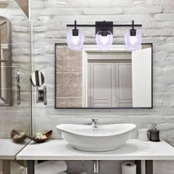 Cain 25 in. 3-Light Matte Black Vanity Light with Clear Glass Shade by CANARM -HINKLEY || CANARM Shop matte black canarm vanity lighting ivl1019a03bk 1f 1000